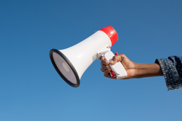 A megaphone in a persons hand